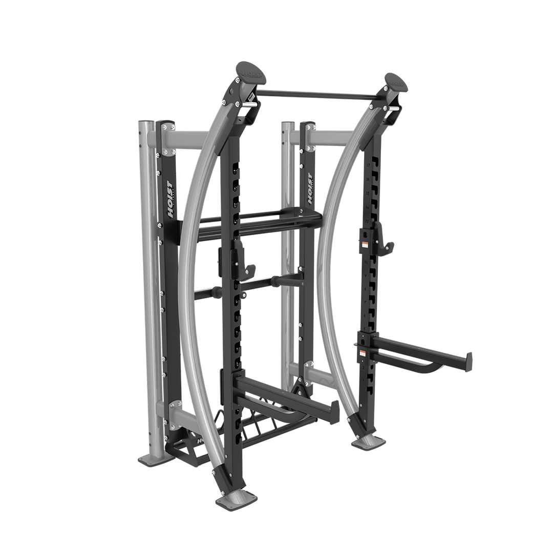 angled view of Hoist functional fitness rack featuring multi-use workout stations, storage pegs, and heavy-duty gym construction