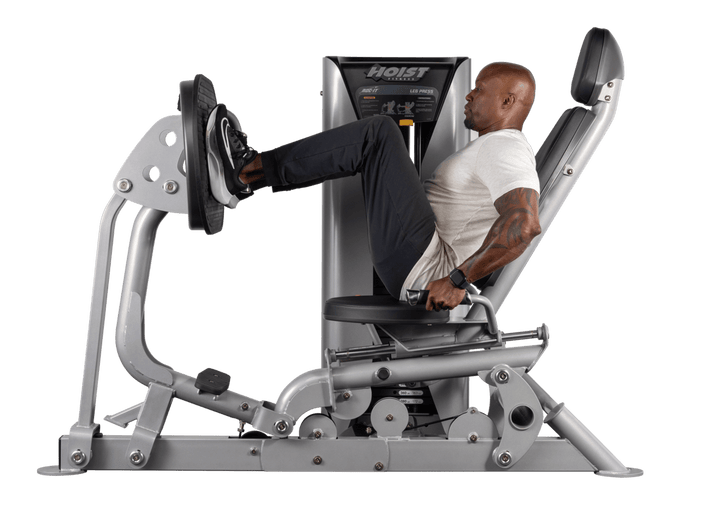 athlete performing seated leg press exercise on Hoist commercial lower body strength machine