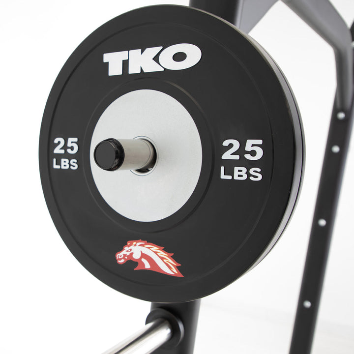 Custom competition bumper plate mounted on storage rack for strength training