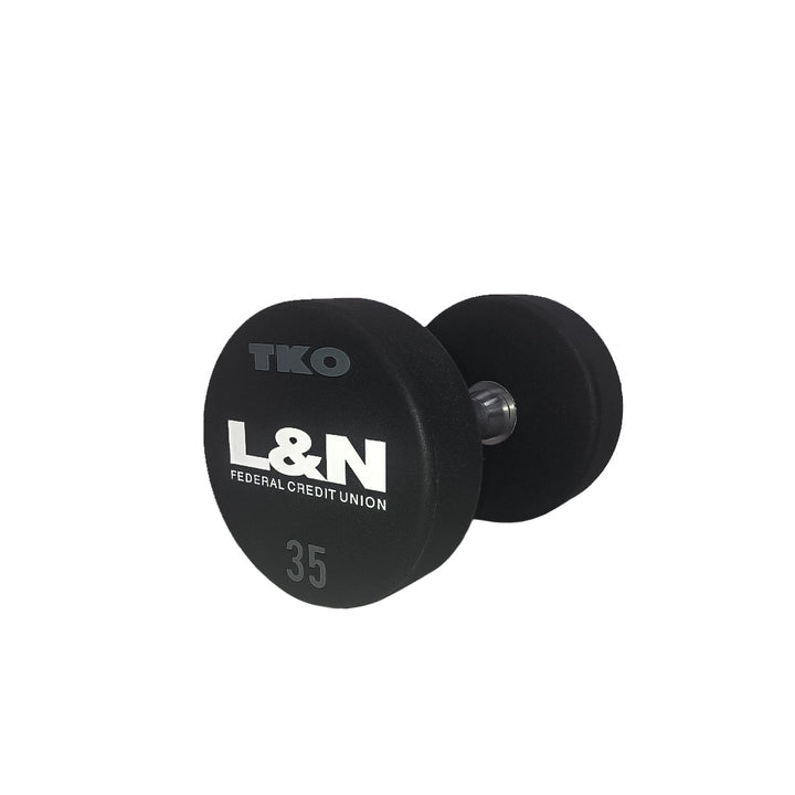 Close-up view of laser-engraved custom logo on a urethane dumbbell