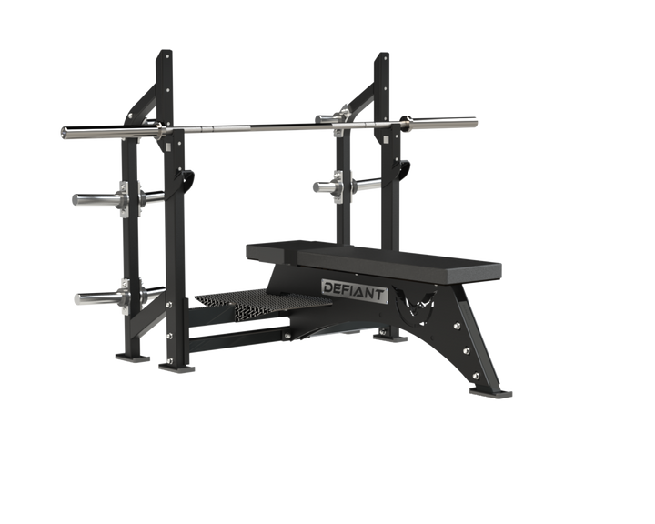Defiant Strength Olympic flat bench with pivoting knee rests and Olympic plate storage.