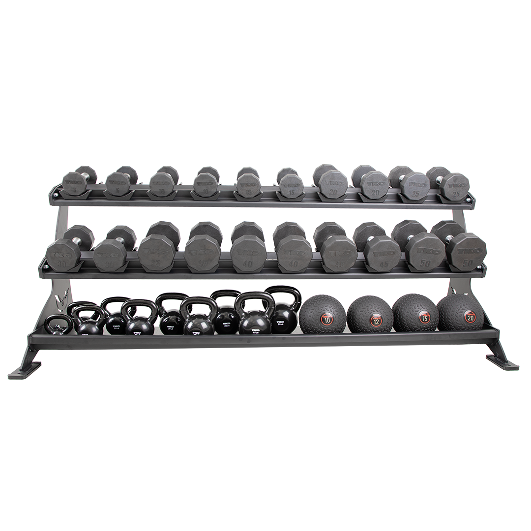 Defiant Strength 3 tier tray rack storing dumbbells, kettlebells, and wall balls.