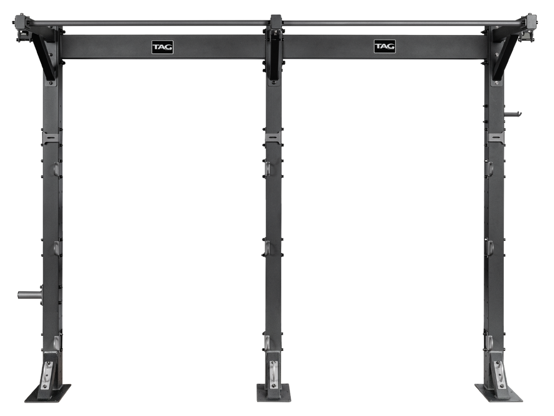 Front view of bolt down fitness bay frame with overhead bar and floor-mounted uprights