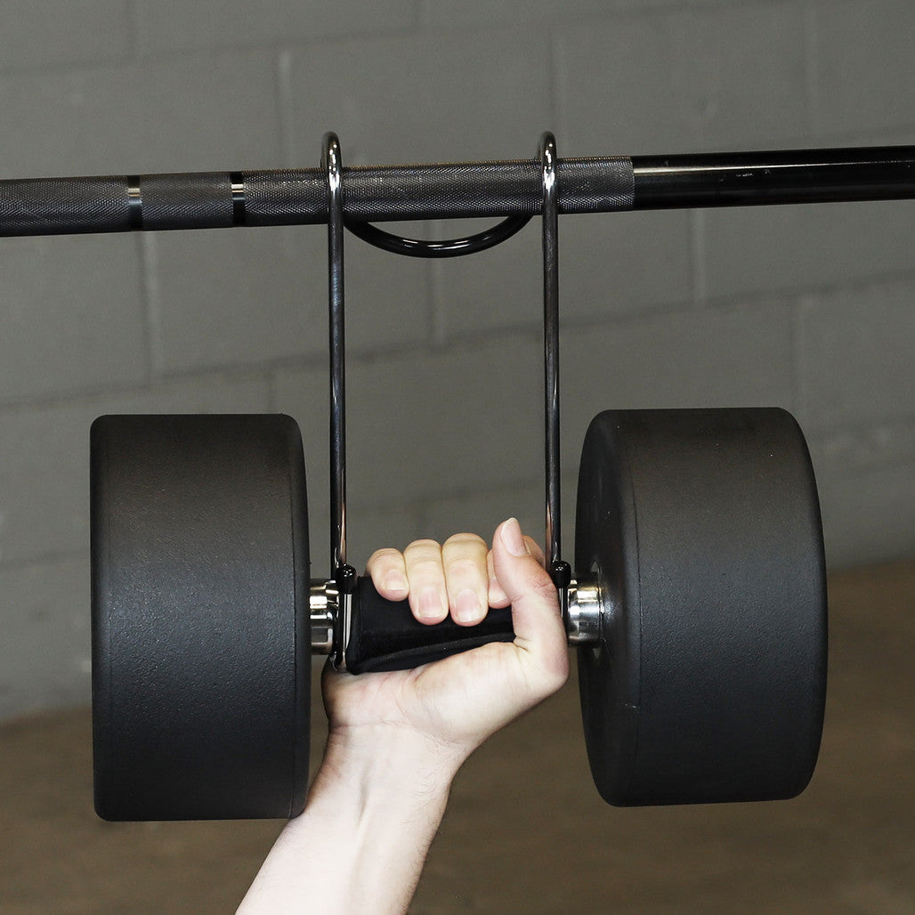 Close-up of a dumbbell supported by Body-Solid dumbbell spotter hooks during strength training.
