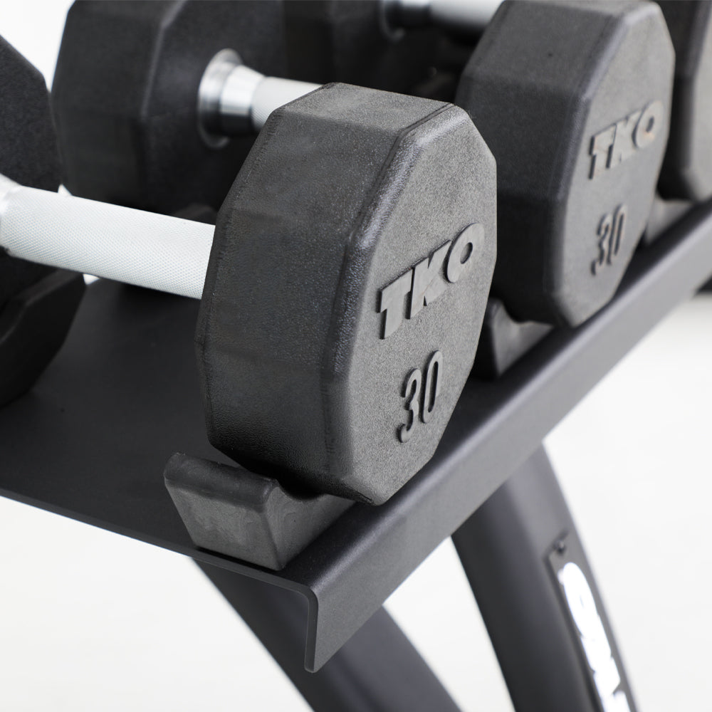 Protective saddle design supporting stored dumbbells