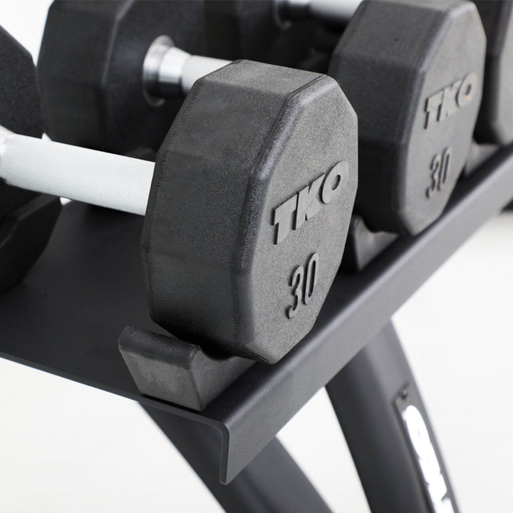 Protective saddle design supporting stored dumbbells