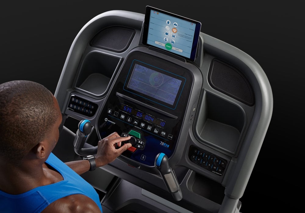 Close-up of the Horizon Elite 7.0 AT treadmill console with workout display and tablet holder.