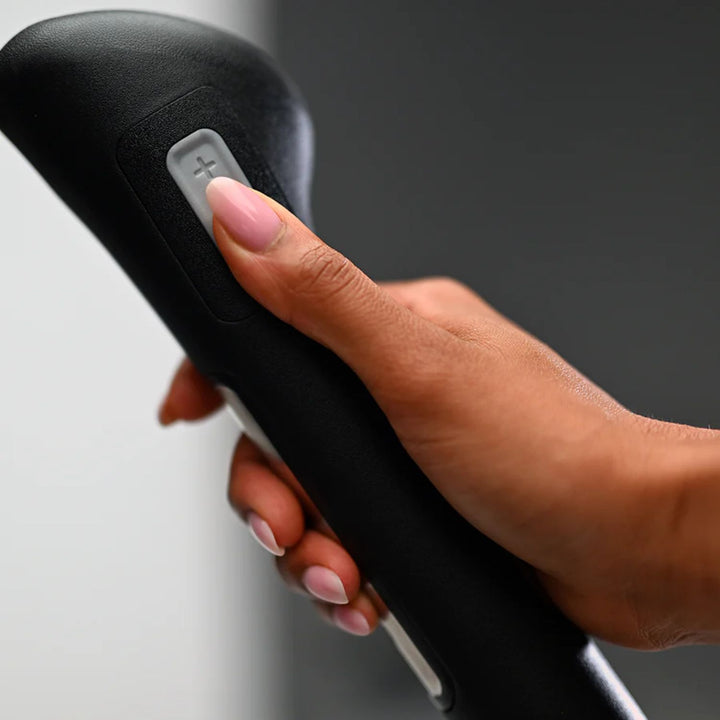 Elliptical handlebar detail with integrated resistance controls for customized workout intensity