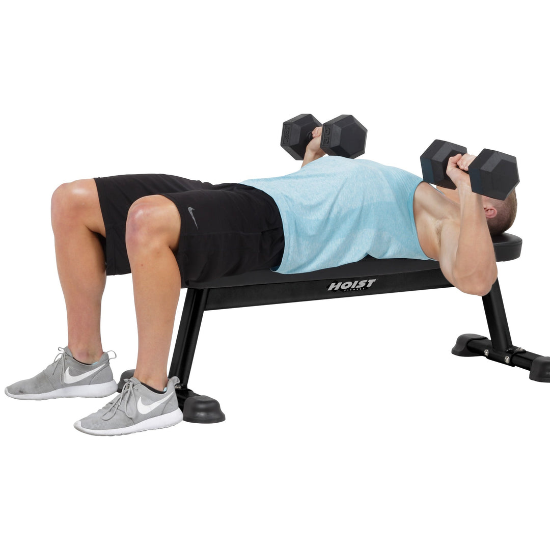 Flat utility bench dumbbell chest press for upper body strength training and muscle development workouts