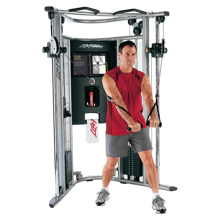 Life Fitness G7 home gym dual pulley system with user performing standing cable chest fly exercise
