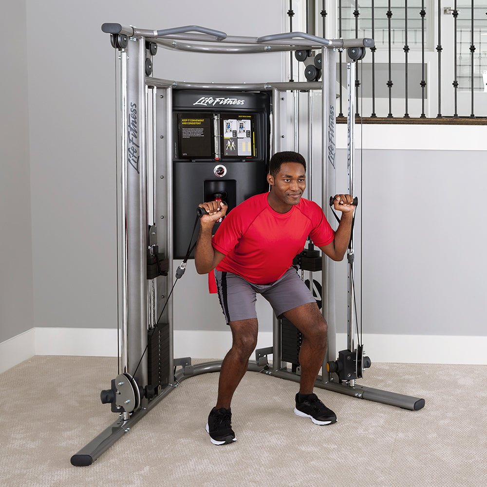 Life Fitness G7 home gym with user performing cable squat exercise using adjustable pulley resistance system