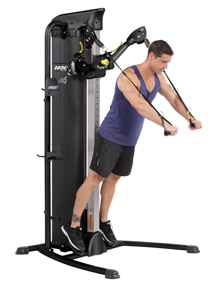 HOIST Mi5 functional trainer chest fly exercise using dual cables for upper body strength and muscle development