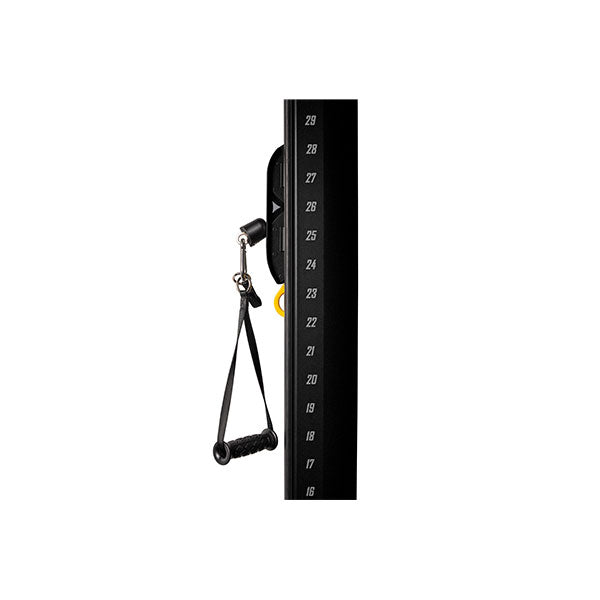 Close-up of weight stack with selector pin and numbered resistance levels on multi station gym