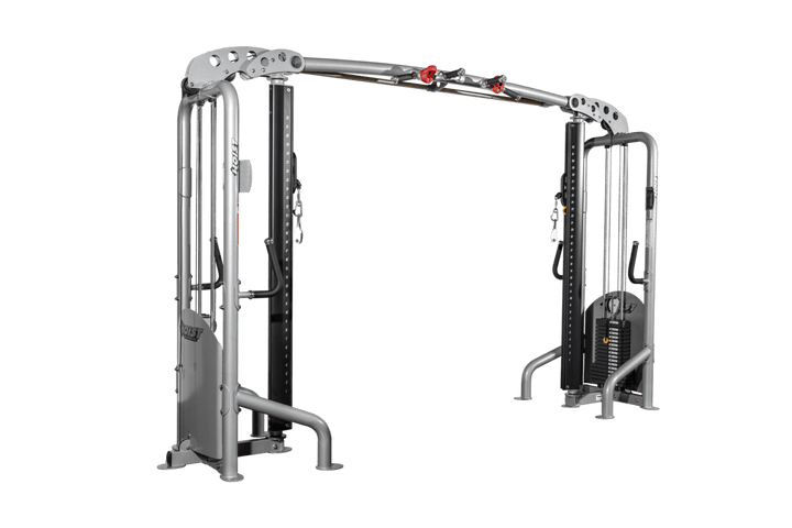 Angled view of cable crossover showing dual towers, connecting pull-up bar, and open workout space