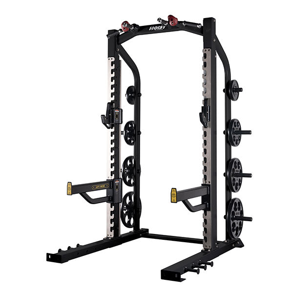 Hoist commercial half rack with barbell supports and weight plate storage for strength training and squats