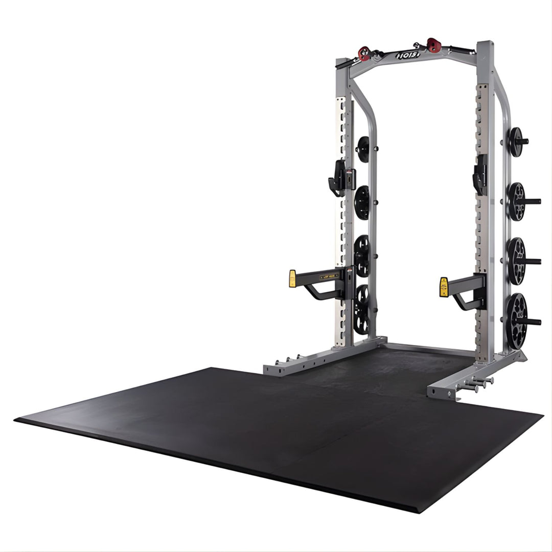 Hoist half rack in silver frame with integrated lifting platform and plate storage for strength training