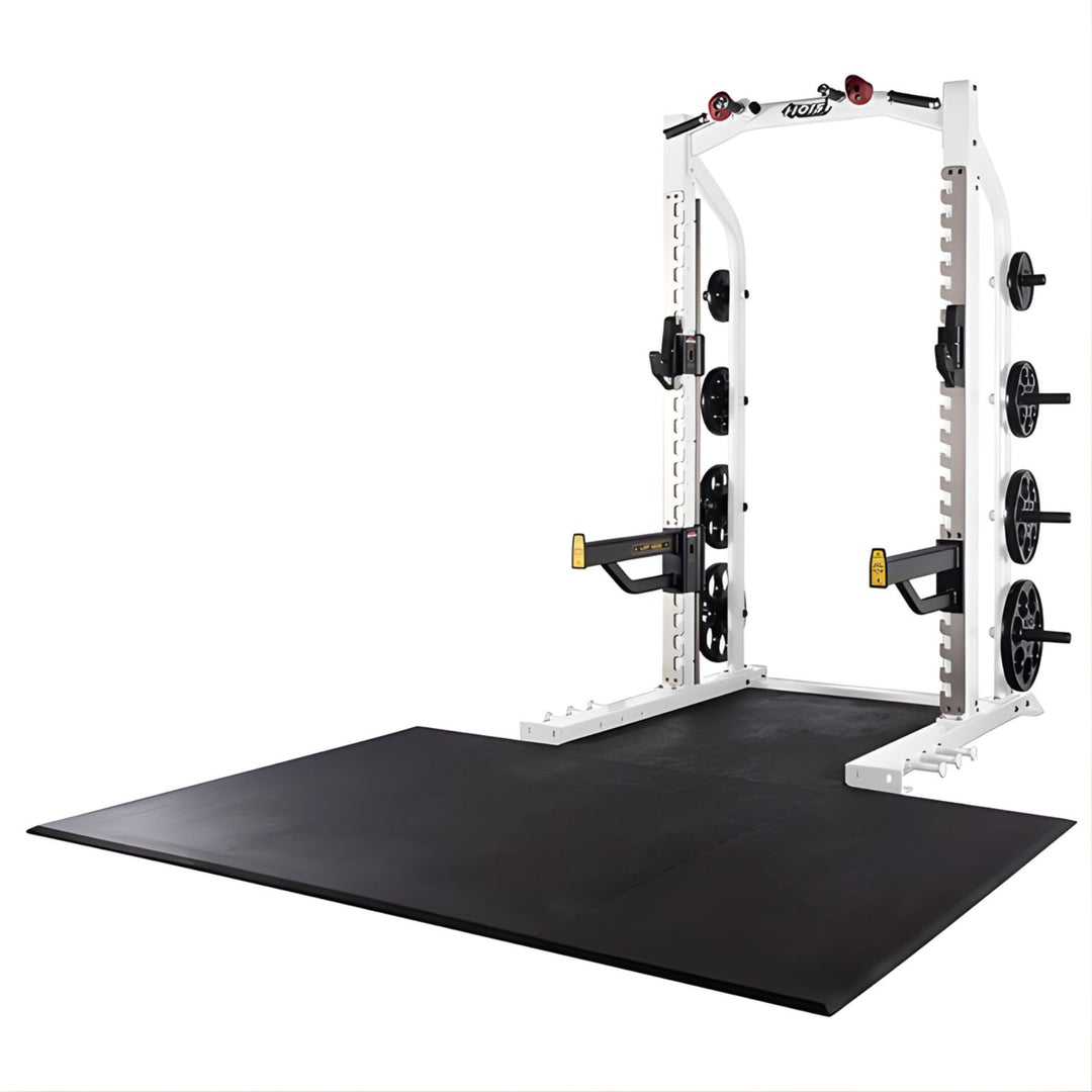 Hoist half rack in white frame with lifting platform and weight plate storage for commercial gym use