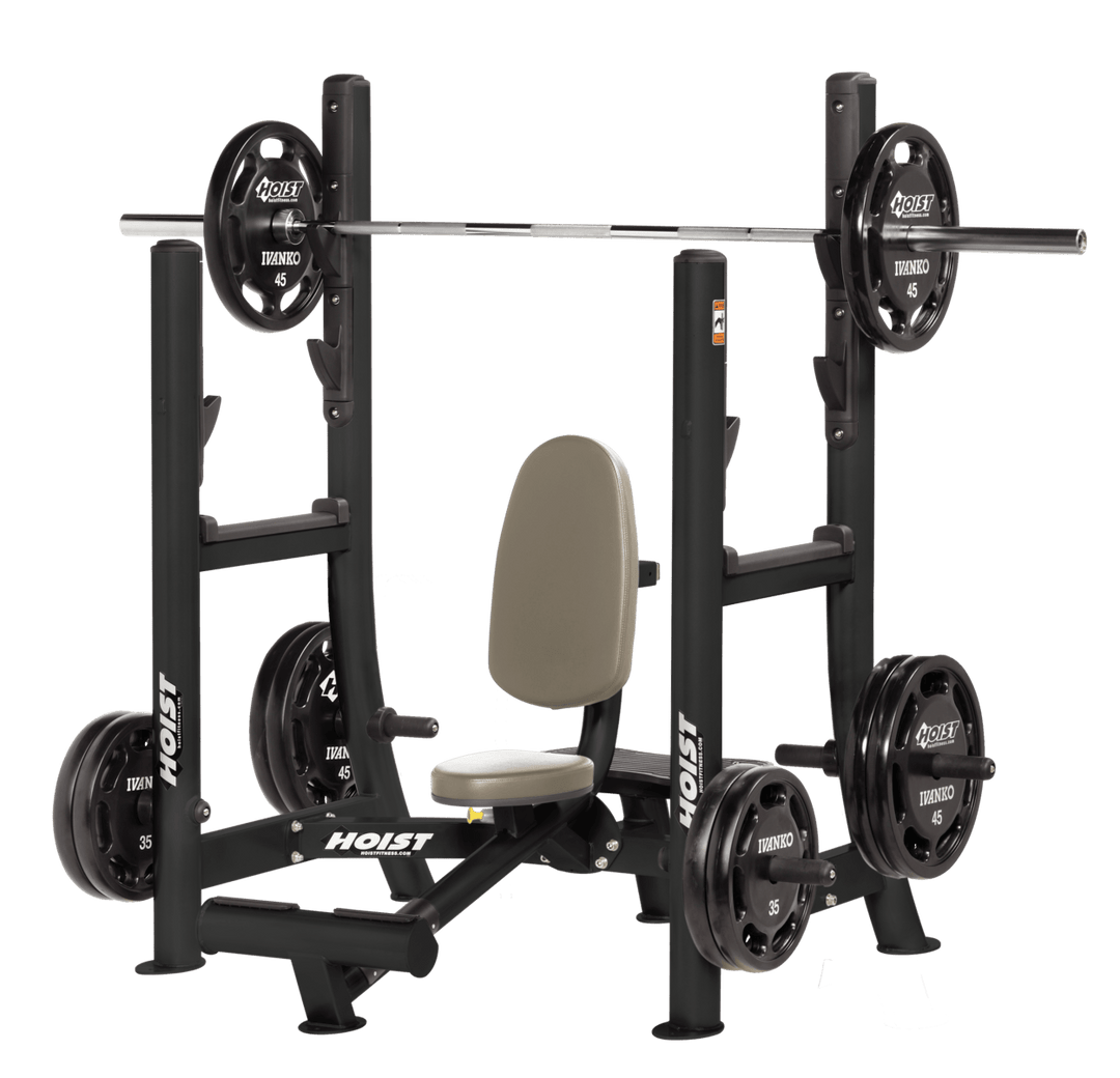 Commercial military press machine with seated back support and plate-loaded arms for shoulder strength training