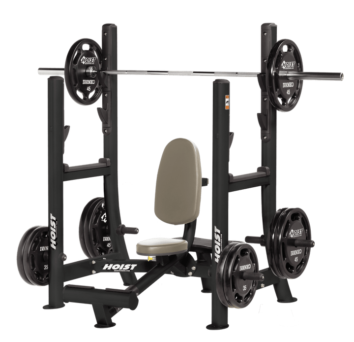 Commercial military press machine with seated back support and plate-loaded arms for shoulder strength training