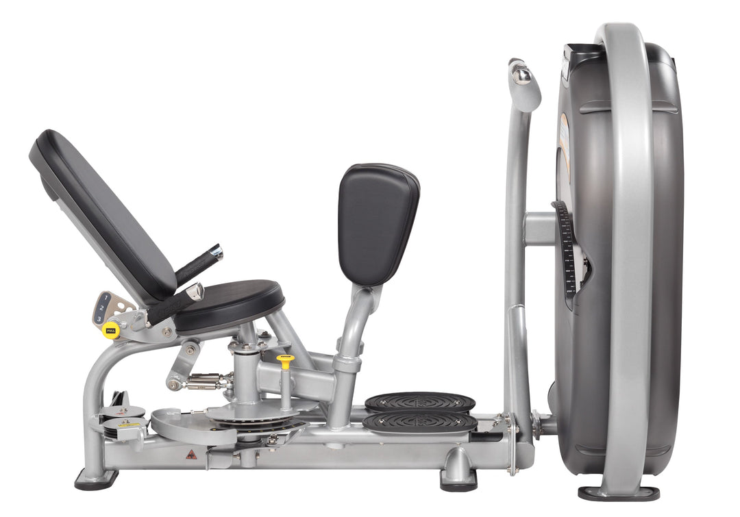 Side view of user seated on thigh machine showing leg positioning and symmetrical movement during exercise