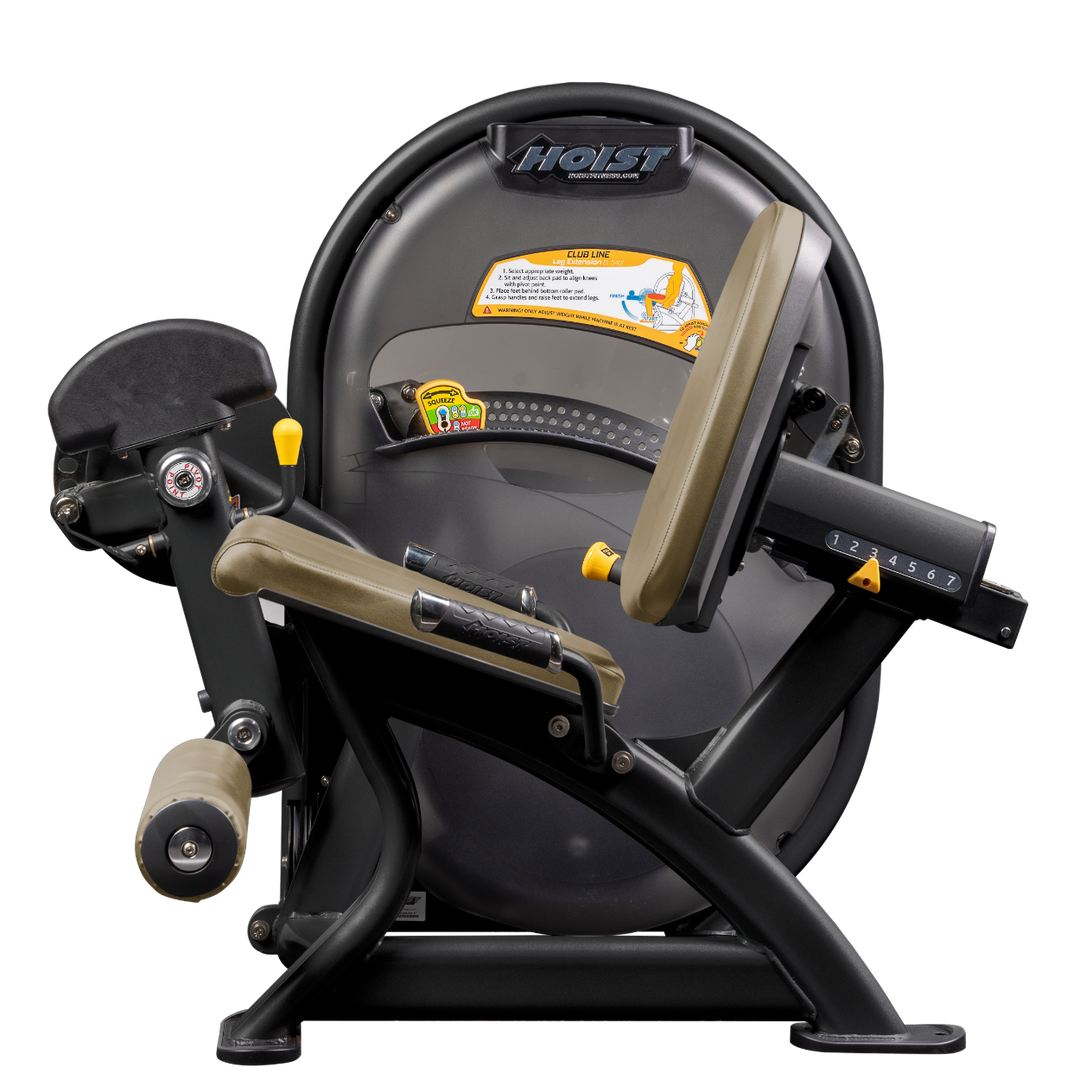 Seated leg extension machine with padded ankle rollers and adjustable seat for quadriceps training