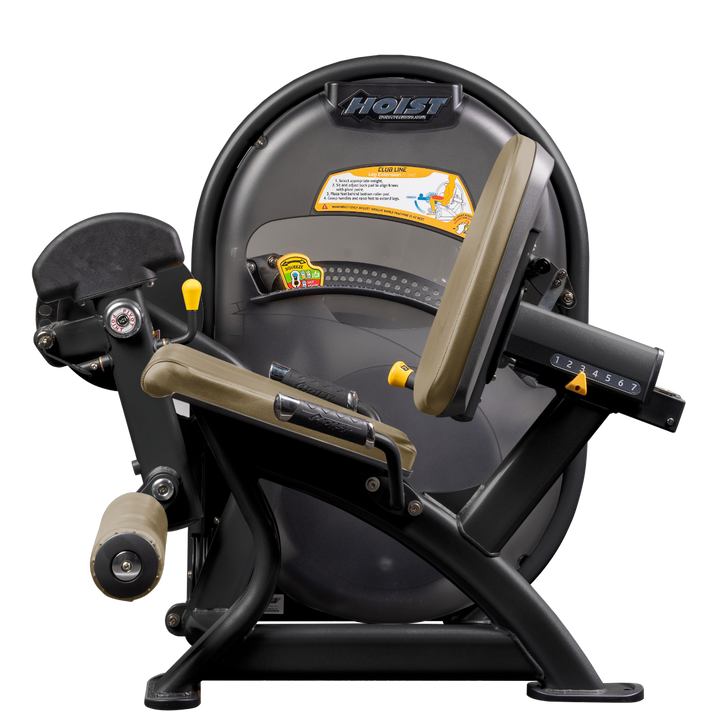 Seated leg extension machine with padded ankle rollers and adjustable seat for quadriceps training