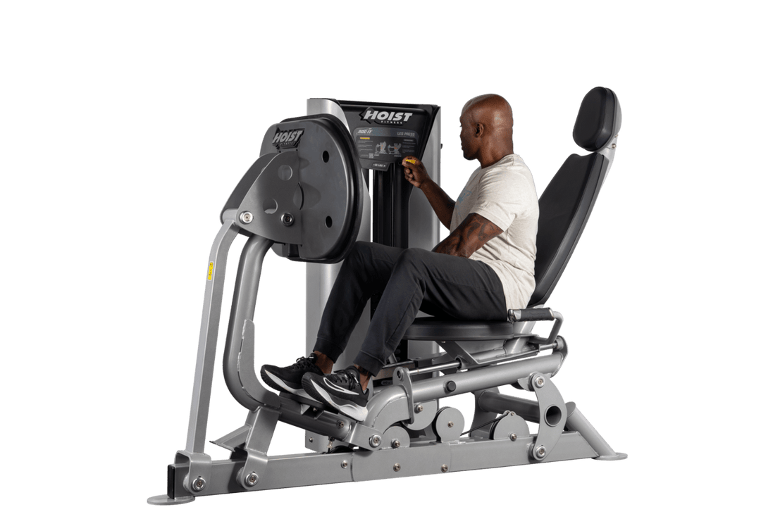 user training on selectorized leg press machine demonstrating lower body resistance exercise movement
