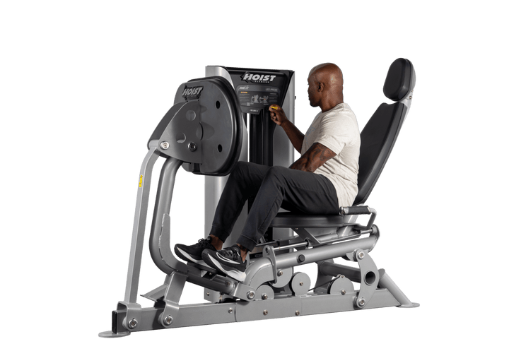 user training on selectorized leg press machine demonstrating lower body resistance exercise movement