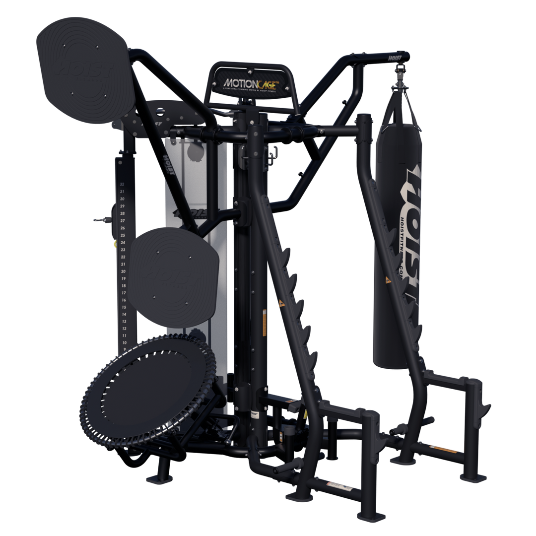 front angled view of Motion Cage Studio Package 5 featuring boxing bag, rebounder attachment, and integrated weight storage