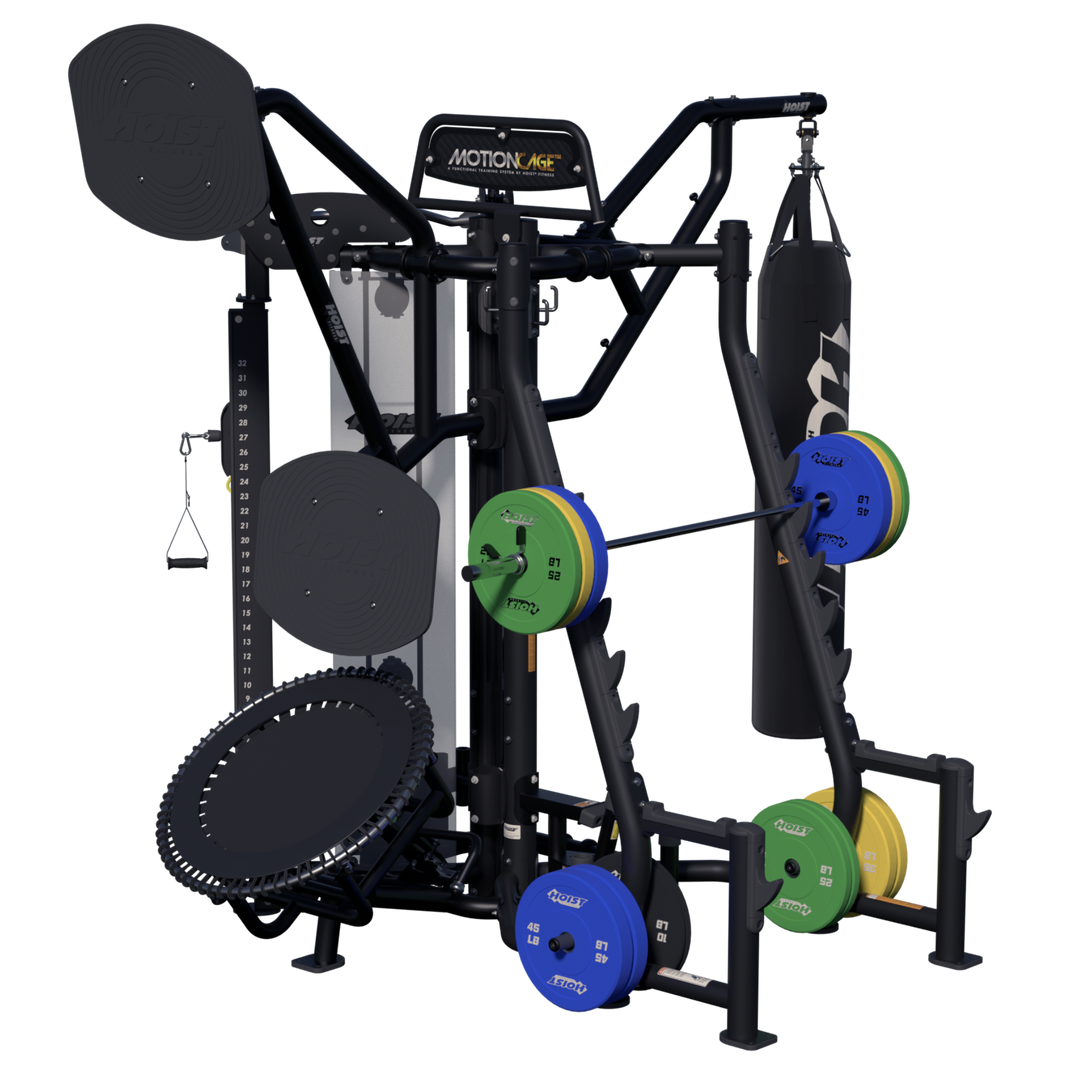 Hoist Motion Cage Studio Package 5 with rebounder platform, heavy bag station, weight plate storage, and functional training attachments