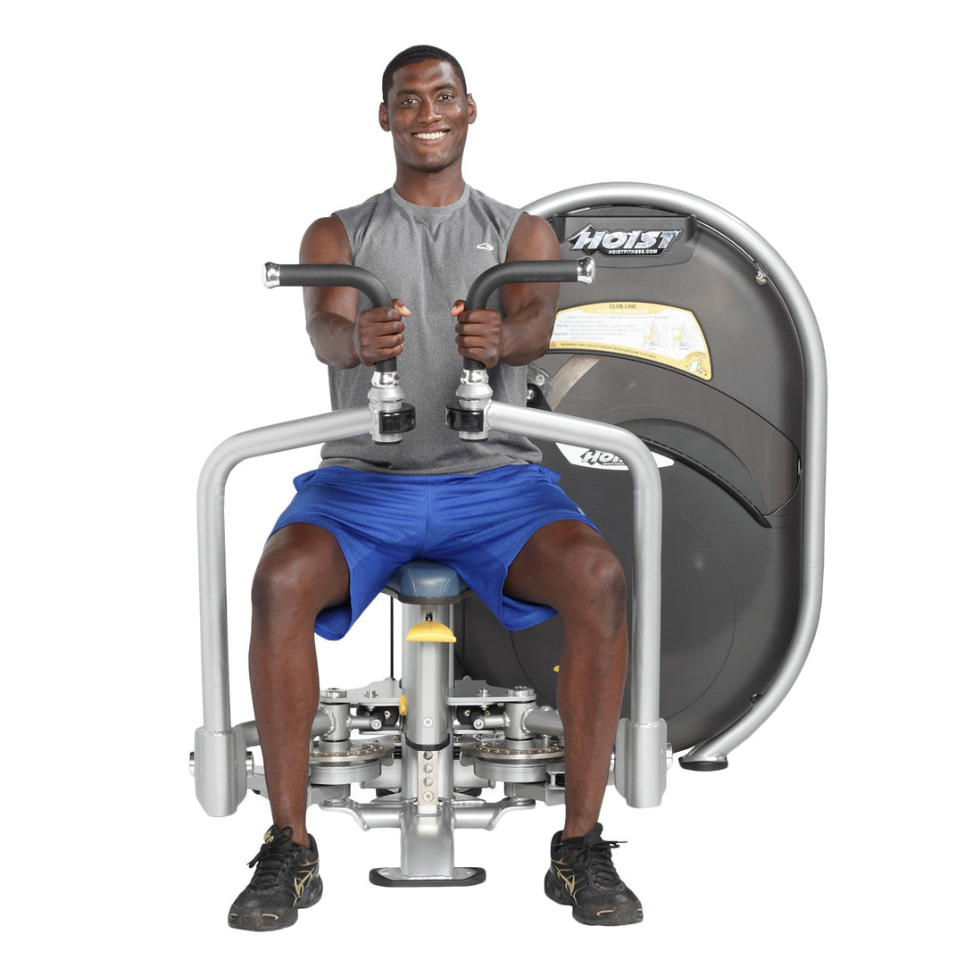 User performing rear delt reverse fly movement targeting shoulders on dual-function machine