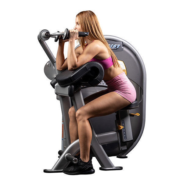 User performing seated triceps extension using overhead handles demonstrating controlled arm extension movement