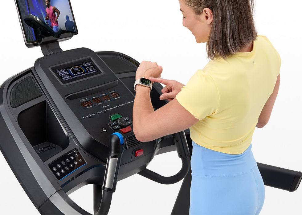 Close-up of the Horizon 7.0 AT treadmill console with QuickDial controls.