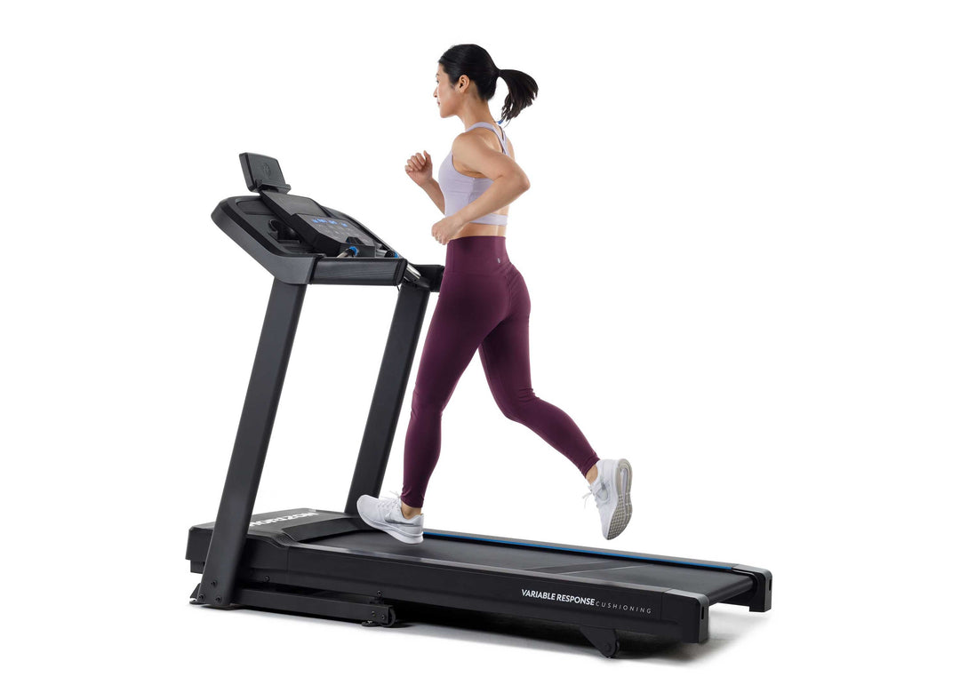 Side view of the Horizon T101 Connect treadmill during a home workout.