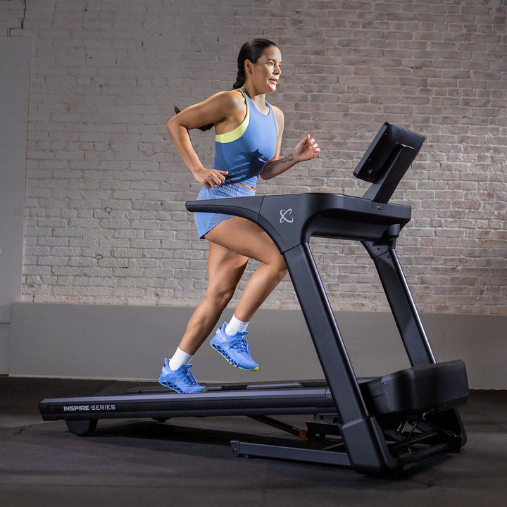 Inspire Series T5 folding treadmill with natural stride technology