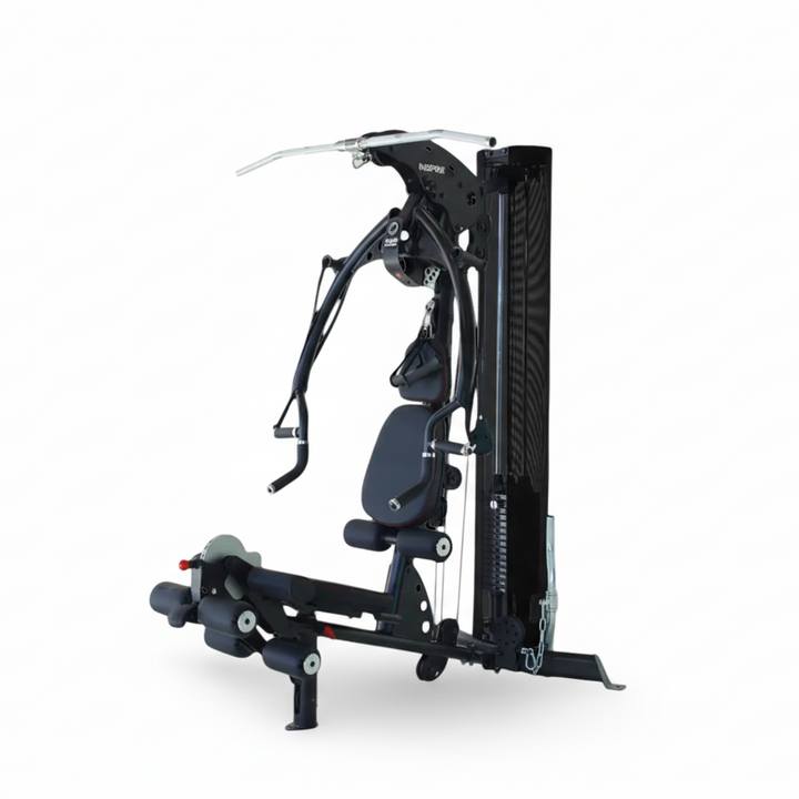 Inspire M2 multi gym with press arms, leg developer, and weight stack for full body strength training in a compact home gym design