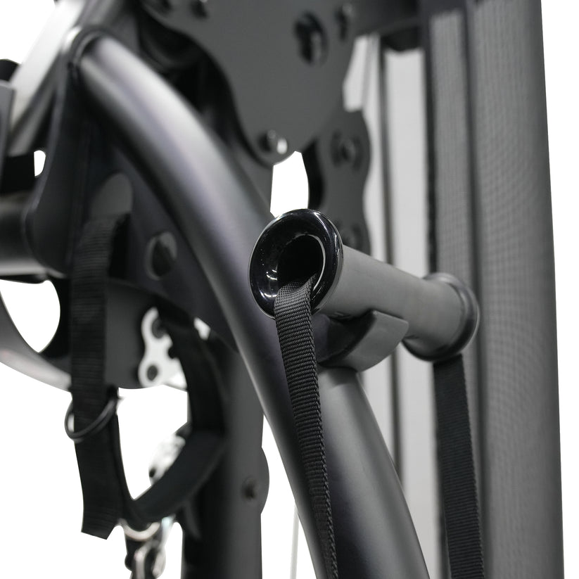 Close up of Inspire M2 multi gym frame and handle connection showing durable construction and cable attachment point