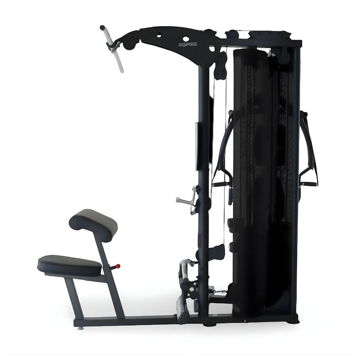 Side profile of Inspire M5 multi gym showing adjustable bench, cable pulleys, and dual weight stacks for home gym use