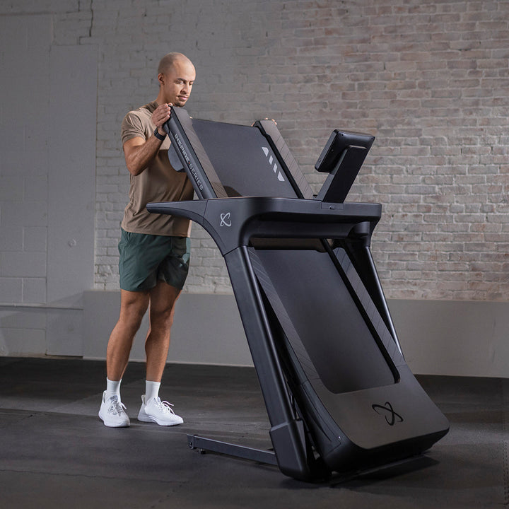 Inspire T4S treadmill side profile showing touchscreen console, running deck, and durable frame for home cardio workouts