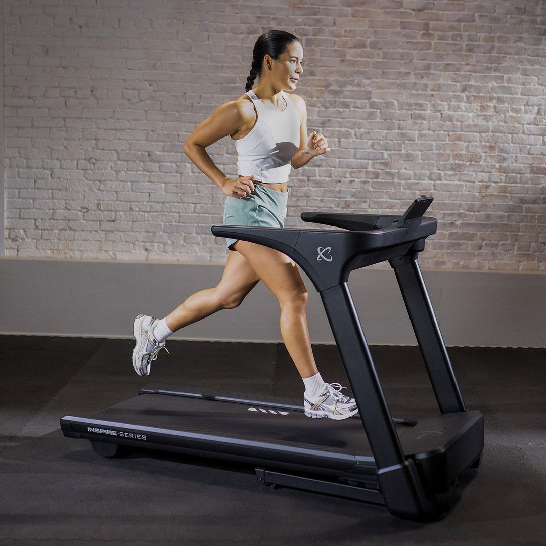 Inspire T4 treadmill with durable running deck, console display, and sturdy frame for home cardio workouts