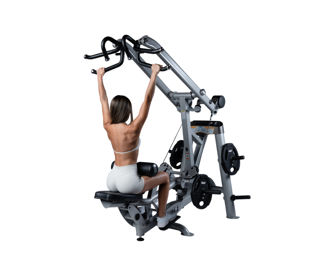 user seated on lat pulldown machine with arms extended overhead gripping handles preparing for back exercise