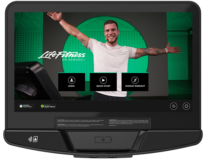 Life Fitness SE4 touchscreen console displaying Life Fitness On Demand workout interface with trainer video and interactive workout options
