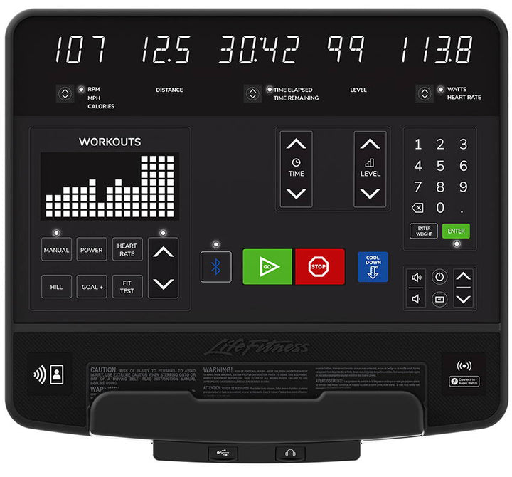 Life Fitness SL console display showing workout metrics including distance time level heart rate and workout programs with control buttons and numeric keypad