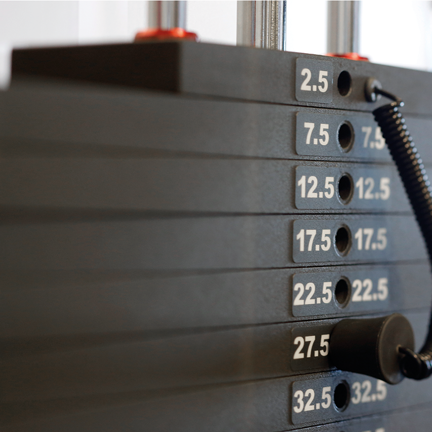 Life Fitness weight stack with selector pin and labeled plates for controlled resistance strength training use