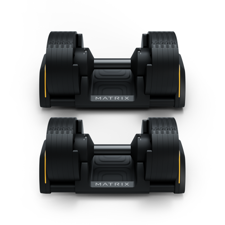 Front view of Matrix 50 lb dumbbells in cradle showing hex design and storage for strength training workouts