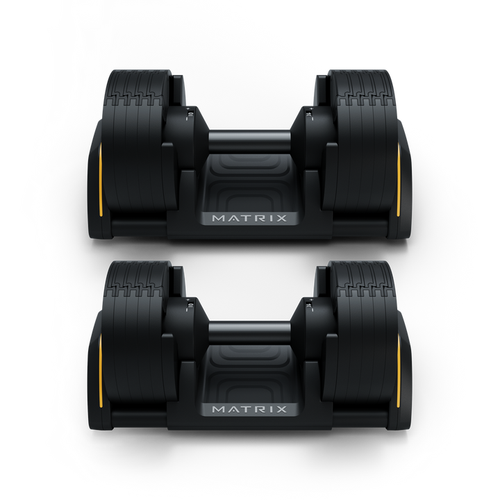 Front view of Matrix 50 lb dumbbells in cradle showing hex design and organized storage for strength training workouts