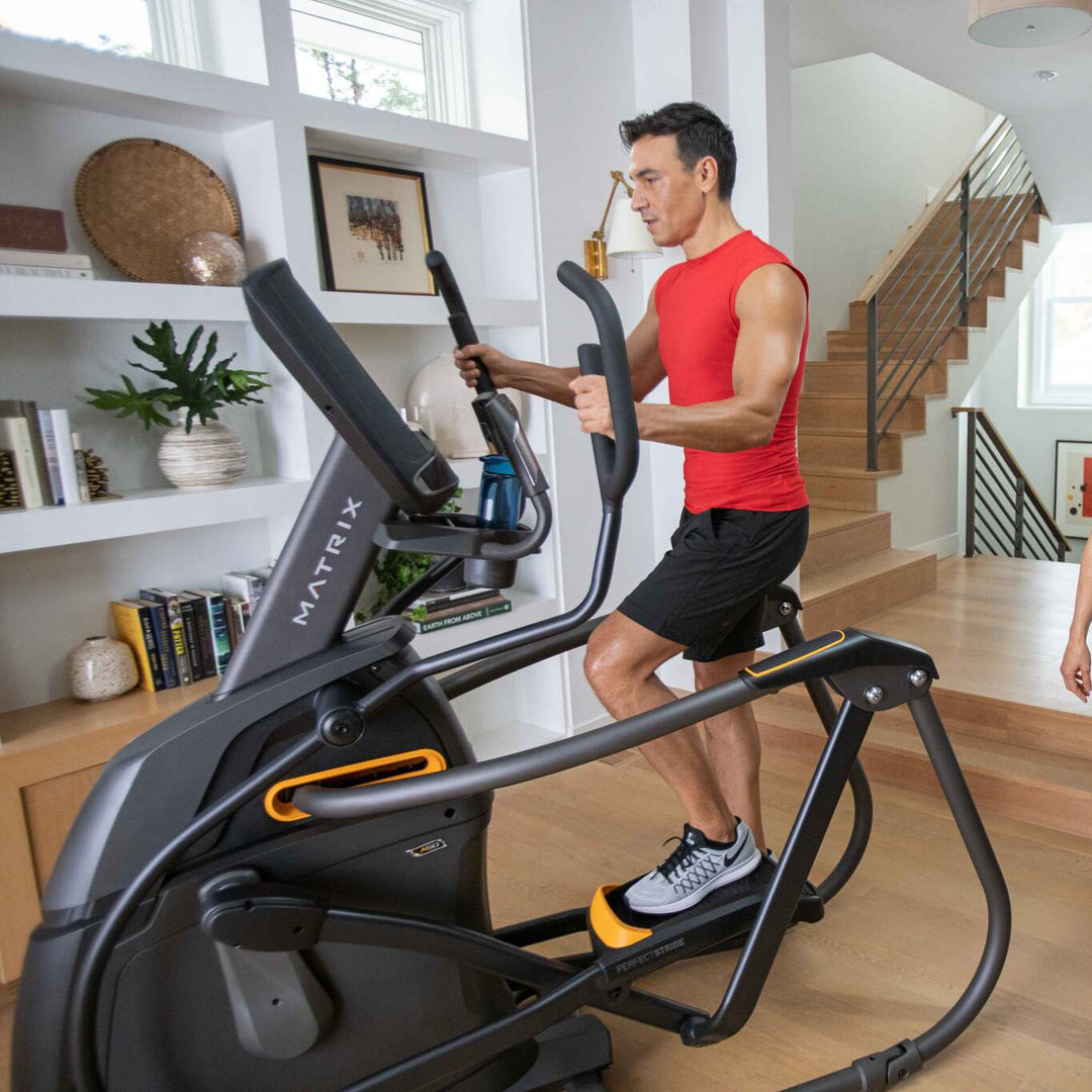 Matrix A30 Ascent Trainer front view with adjustable incline motion and ergonomic handlebars for home cardio workouts