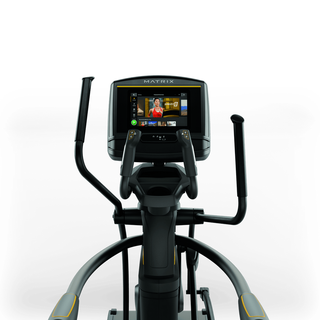 Front view of Matrix A30 Ascent Trainer with XER console showing workout metrics and ergonomic handlebar design