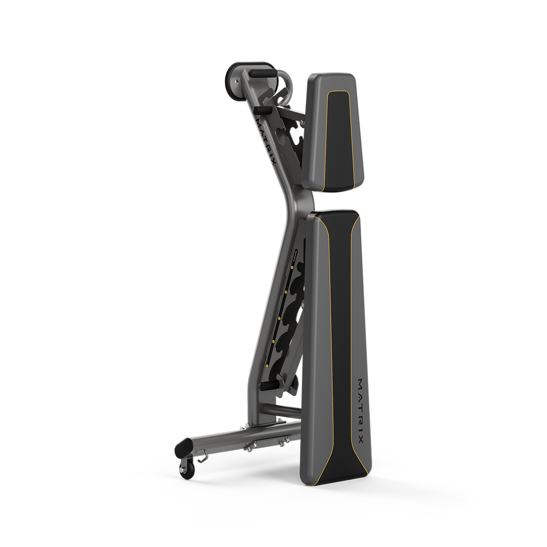 Matrix adjustable weight bench in vertical storage position showing compact design for efficient home gym space use