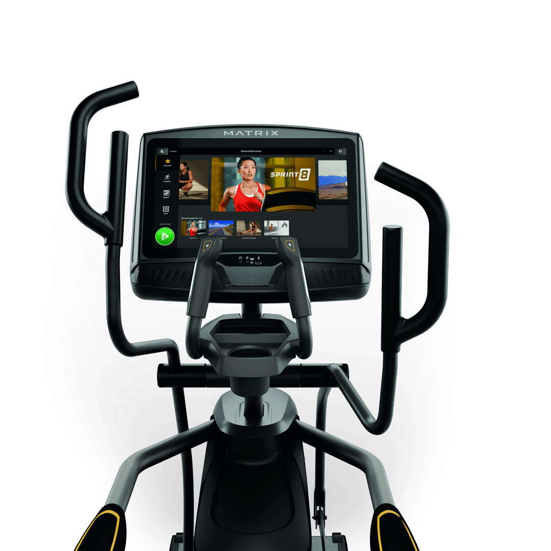 Front view of Matrix E50 elliptical with XUR touchscreen console showing workout metrics and ergonomic handlebar design